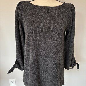 Max Studio Gray knit top with ruched shoulders and 3/4 sleeves with ties at end.
